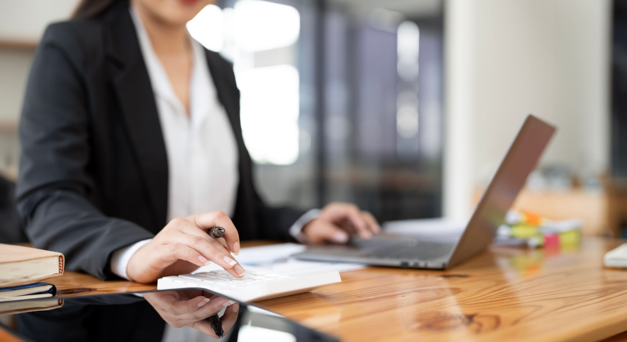 Businesswoman working Financial investment on calculator, calculate, analyze business and marketing growth.